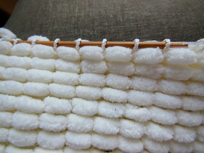 tricoter la laine pompon