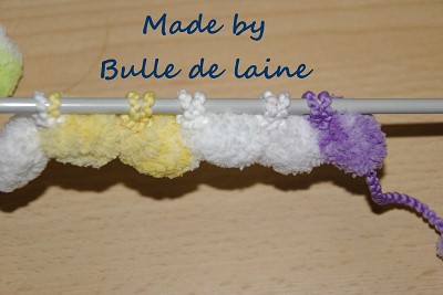 tricoter la laine pompon